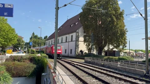DB (Deutsche Bahn) train departs from Konstanz Bahnhof train station. Germany Stock Footage 315668895