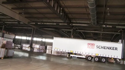 DB Schenker Trailer in Large Warehouse for Shipping and Storage Video stock 315210804