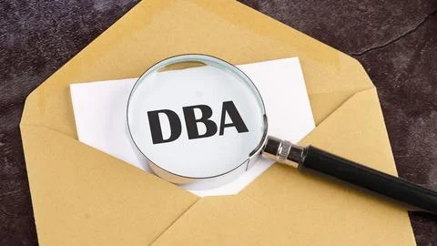 DBA - Database Administrator, acronym business concept written on a blank she Stock Photos