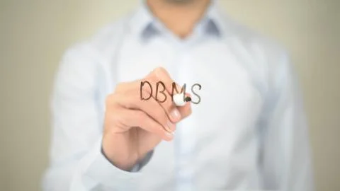 DBMS, Man writing on transparent screen Stock Photos