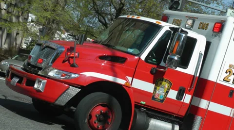 DC EMS ambulance, dutch angle, turns corner Stock Footage 37622955