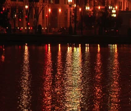 DC - urban streets reflected in a pond at night Stock Footage 12033226