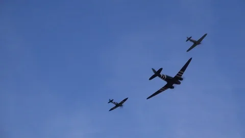 DC3 spitfire and hurricane doing flypast together in air show UK 4K Stock Footage 115957504