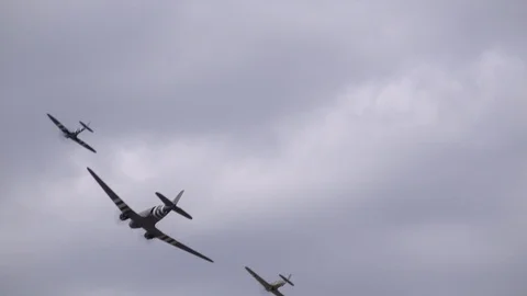 DC3 spitfire and hurricane fly past Military plane in air show UK 4K Stock Footage 115957414