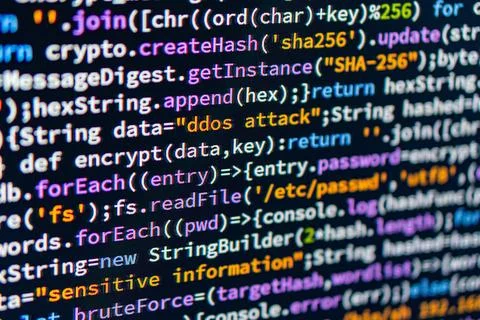 DDoS attack. Close-up view of colorful code on a computer screen, possibly .. 스톡 사진