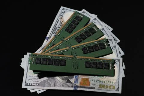 DDR memory modules on US dollar bills. Workstation memory and DDR RAM cost. M Stock Photos