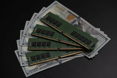 DDR memory modules on US dollar bills. Workstation memory and DDR RAM cost... Stock Photos