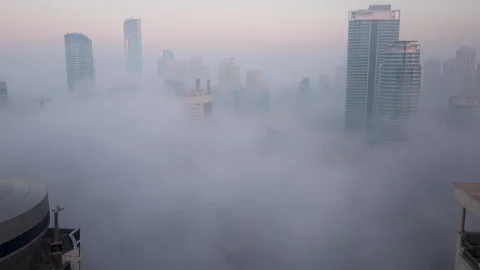 Ddubai Marina above clouds during a beautiful sunrise, timelapse Stock Footage 304445410