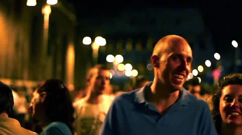 DE-FOCUS CROWD WALKING IN THE NIGHT, COLOSSEUM BACKGROUND Stock Footage 26427102