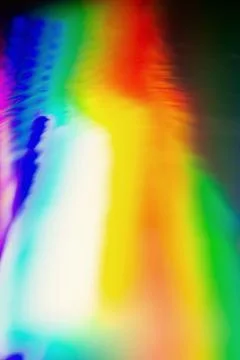 De focused abstract vibrant iridescent holographic rainbow foil background .. Stock Photos