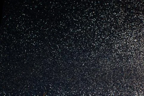 De focused, background of abstract glitter lights. blue, gold and black. Stock Photos