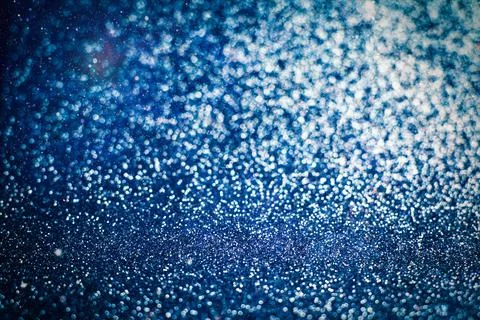 De focused, background of abstract glitter lights. blue, gold and black. Stock Photos