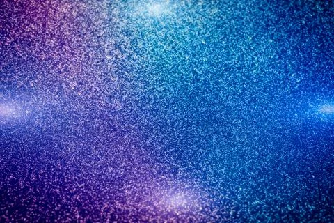 De focused, background of abstract glitter lights. blue, gold and black. Stock Photos