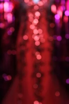 De-focused Bokeh Background With Red Glittery Ball Gown Stock Photos