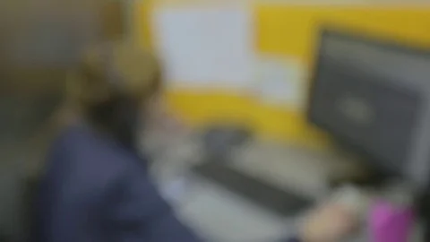 De-focused close-up of a man sitting at his desk screen PC on the table Stock Footage 73723587