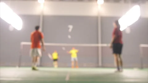 De focused or blurred badminton playing on court Stock Footage 52504577