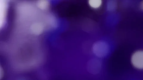De-focused purple background with rotating elements Stock Footage 34870148