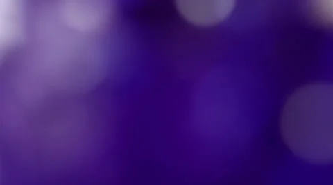 De-focused purple background with rotating elements Stock Footage 34870391