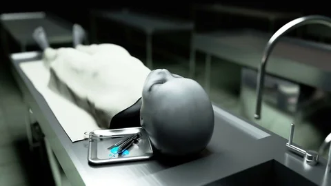 The dead alien in the morgue on the table. Futuristic autopsy concept. Видео 71781143