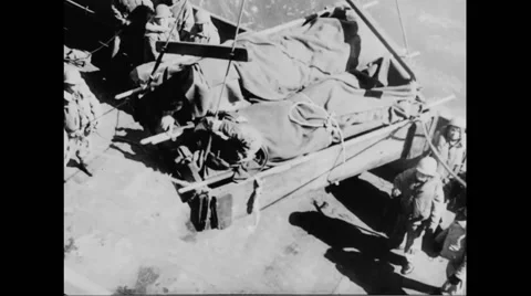 Dead allied soldiers being transferred to hospital Stock Footage