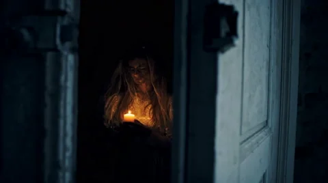 Dead bride with a candle in hand in an abandoned house at night Stock Footage 69051948