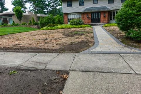 Dead brown lawn in front of a large house Stock Photos