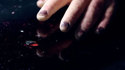 Dead hand on a table Stock Footage 75879247