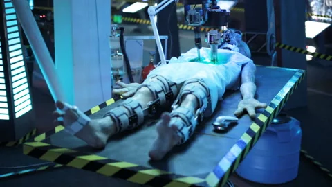 Dead humanoid alien lying on the table Stock Footage 103460244