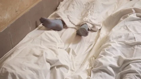 Dead man's foot covered with a sheet. Many victims of coronavirus infected Stock-Footage 204013672