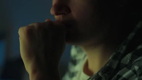 In the dead of night man is deeply engrossed in analyzing financial data on Stock Footage 256181290