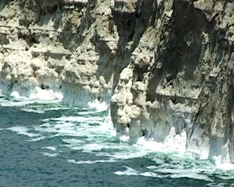 Dead Sea. Jordan. Sheer cliffs covered with white salt crystals. Video stock 120721766