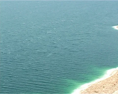 Dead Sea. Jordan. Sheer cliffs covered with white salt crystals. Stock Footage 120721771