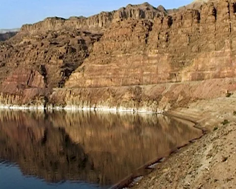 Dead Sea. Jordan. Sheer cliffs covered with white salt crystals. Stock Footage 126008634
