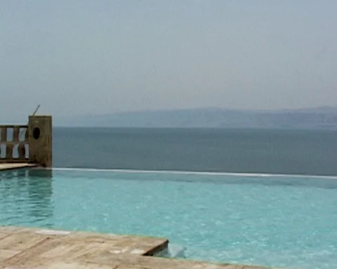 Dead Sea. Jordan. View of Dead Sea waters through hotel pool. Video stock 114649193