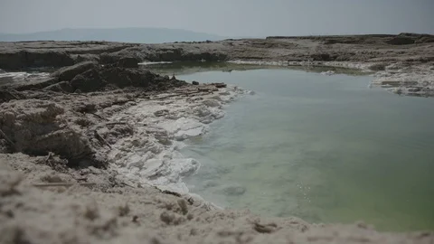 Dead Sea shores, side pocket of water caked with salt, part two Stock Footage 86058853
