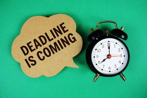 Deadline Is Coming text on speech bubble with alarm clock on green background Stock Photos