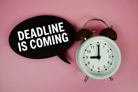 Deadline Is Coming text on speech bubble with alarm clock on pink background Stock Photos