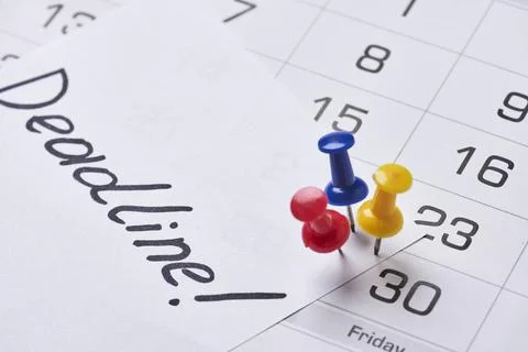 Deadline concept. A paper with Deadline text pinned on monthly calendar Stock Photos