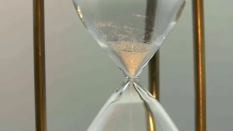 Deadline. Time is over. Macro shot of sand in the hourglass. Stock-Footage 97600004