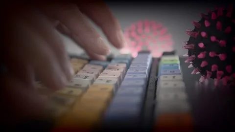 Deadly coronavirus on the keyboard Stock Footage 126912495