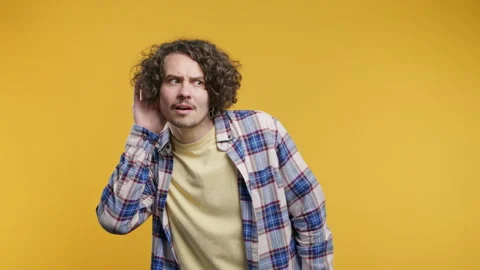 Deaf curly man doesn't hear, asks what. Quiet whisper sound, deafness problems Stock Footage 279861267