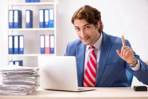 Deaf employee using hearing aid in office Fotos Stock