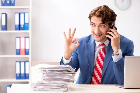 Deaf employee using hearing aid in office Fotos Stock
