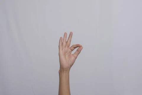 Deaf gesture "Oke" by hand. The gesture "Oke" in sign language, isolated on.. Stock Photos
