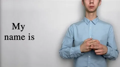 Deaf guy with Asian features in blue shirt on white background saying my name is 스톡 동영상 119284810