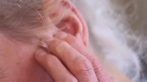 Deafness and hearing loss on grey background with people stock video stock Stock Footage 324845298