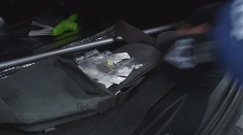 Dealer Checking And Counting His Stash In The Trunk Of His Car Vídeos de archivo 34229049