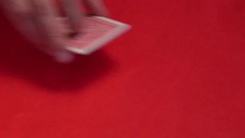 Dealer hand checking five cards in poker game. Stock Footage 75207744