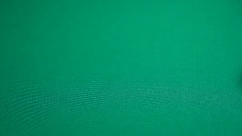 The dealer rolls nine on dice. Slow motion two red dice, craps, thrown on green Stock Footage 124824560