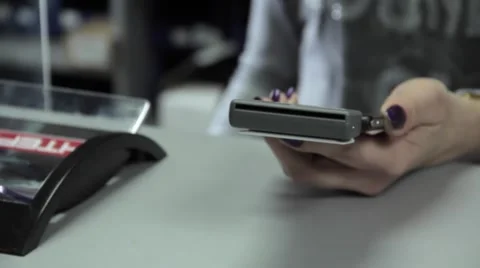 Dealer serving the customer with a smartphone Stock Footage 64172080